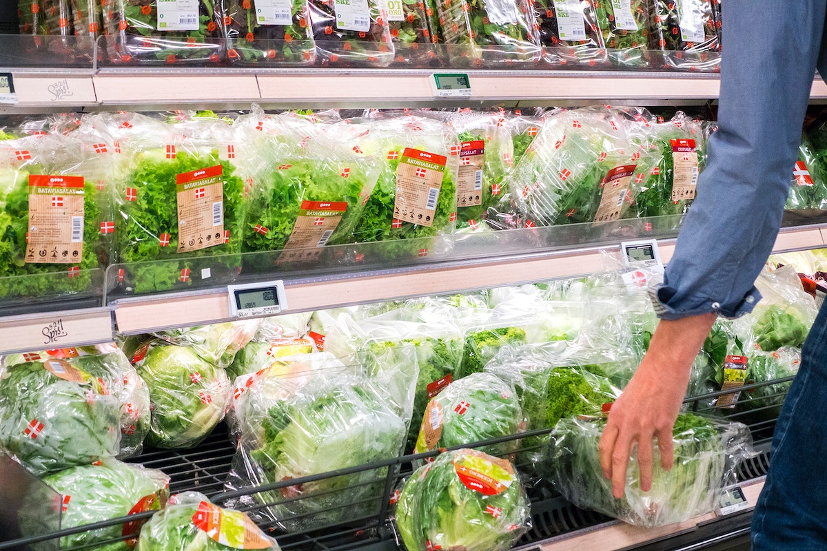 Buying lettuce in a grocery store
