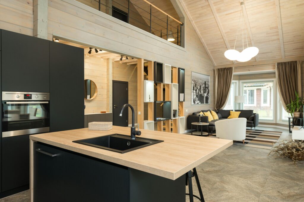 Spacious open-plan modern living room and kitchen with contemporary design elements.